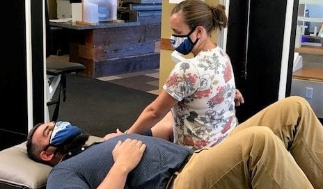 physical therapist working on shoulder mobility