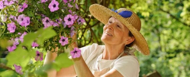 Senior Woman Tending Flowers