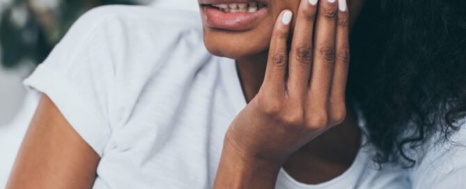 African American woman experiencing jaw pain
